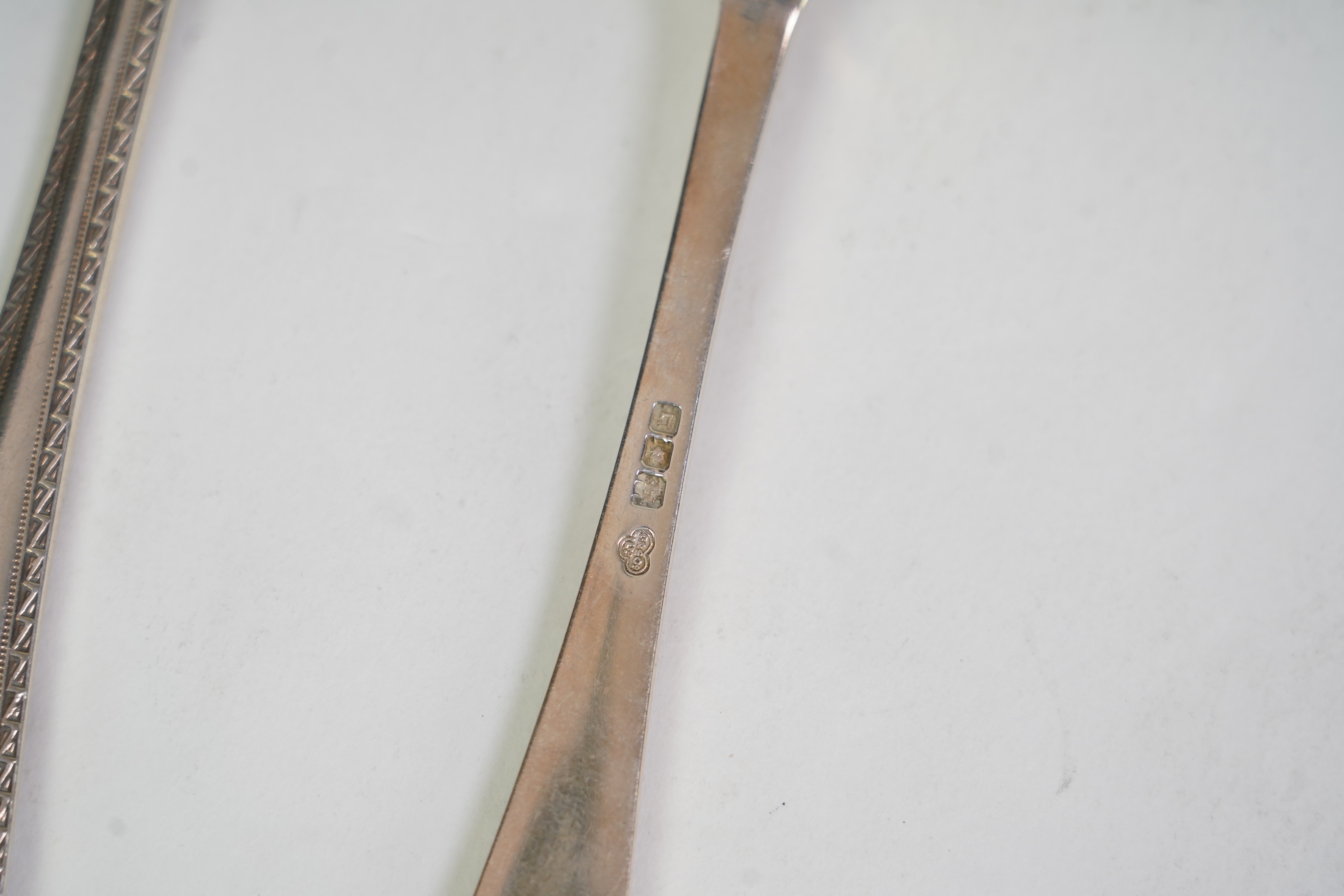 A set of six George V fancy Old English pattern table spoons by Elkington & Co, Birmingham, 1919, 22.2cm, together with a set of six fancy Hanoverian pattern table forks, Goldsmiths & Silversmiths Co Ltd, London, 1918, 3